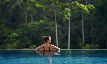 The Westin Resort and Spa Ubud infinity pool with a tranquil forest backdrop
