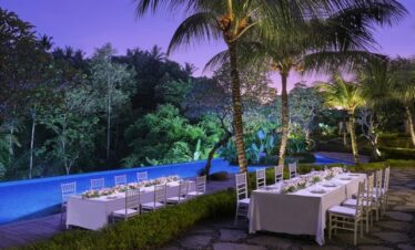 The Westin Resort and Spa Ubud outdoor dining setup under palm trees