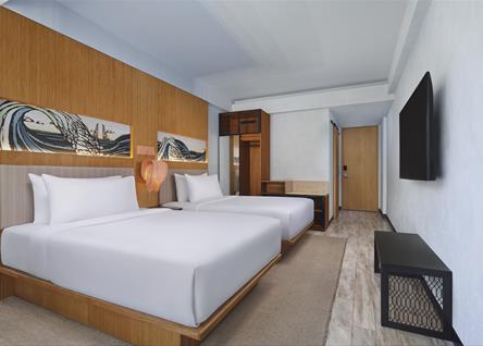 Twin bedroom at ALOFT BALI with modern decor and natural light