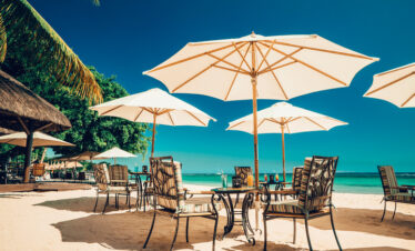 Beachfront dining at Maritim Resort with shaded tables