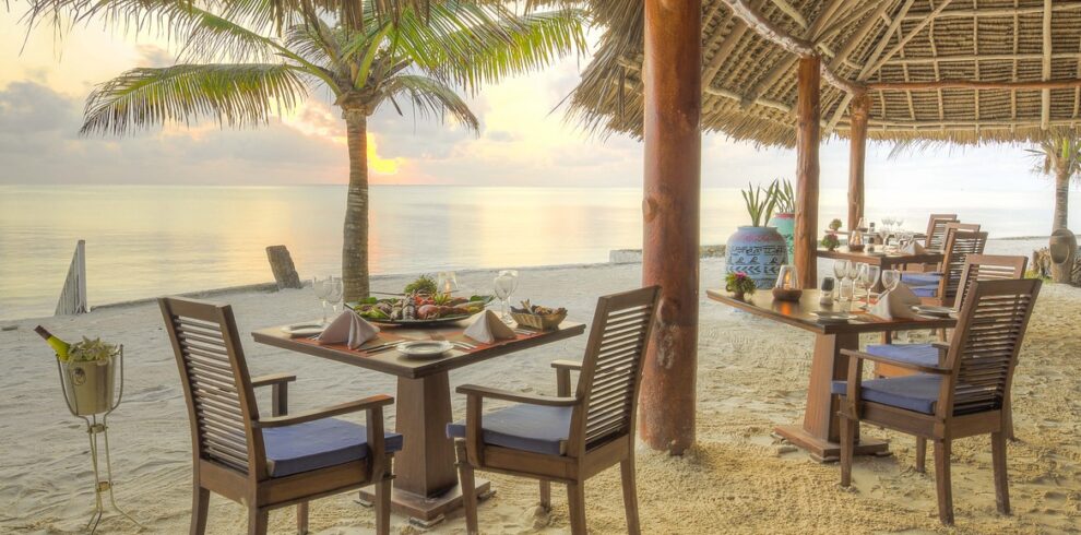 Bluebay Beach Resort beachfront dining with ocean views and sunset ambiance