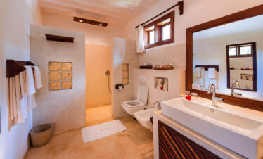 Elegant bathroom at Diamonds Mapenzi Beach Resort with modern amenities