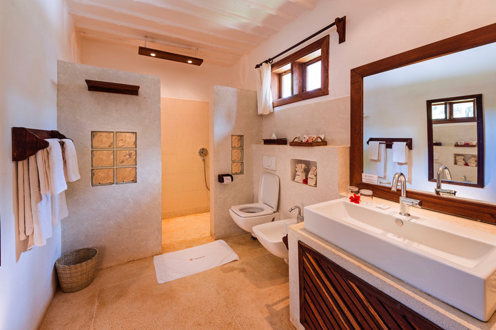 Elegant bathroom at Diamonds Mapenzi Beach Resort with modern amenities