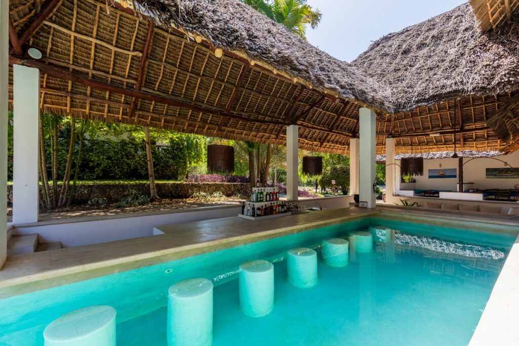 Karafuu Beach Resort swim-up bar with thatched roof and tropical setting