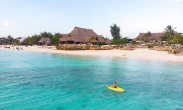 Kayaking in crystal waters near Sandies Baobab Beach Resort beachfront