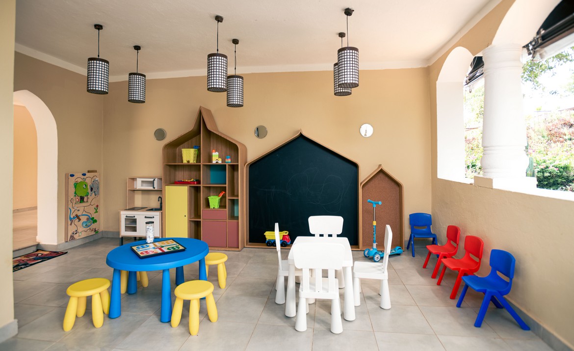 Kids playroom with colorful tables and chairs at Tui Blue Bahari