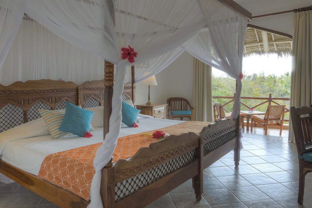 Luxurious suite at Bluebay Beach Resort with a private balcony and garden view