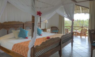 Luxurious suite at Bluebay Beach Resort with a private balcony and garden view