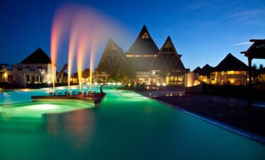 Night view of the pool and main building at Essque Zalu Zanzibar