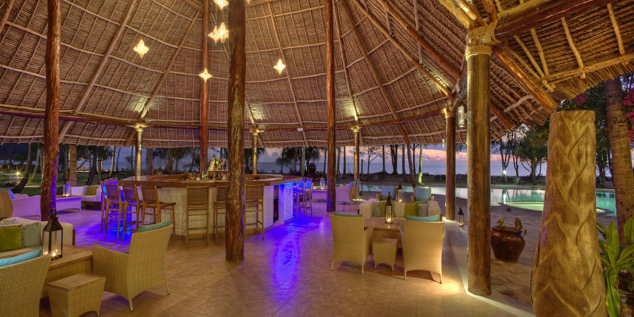 Open air bar at Bluebay Beach Resort with tropical cocktails and ocean views