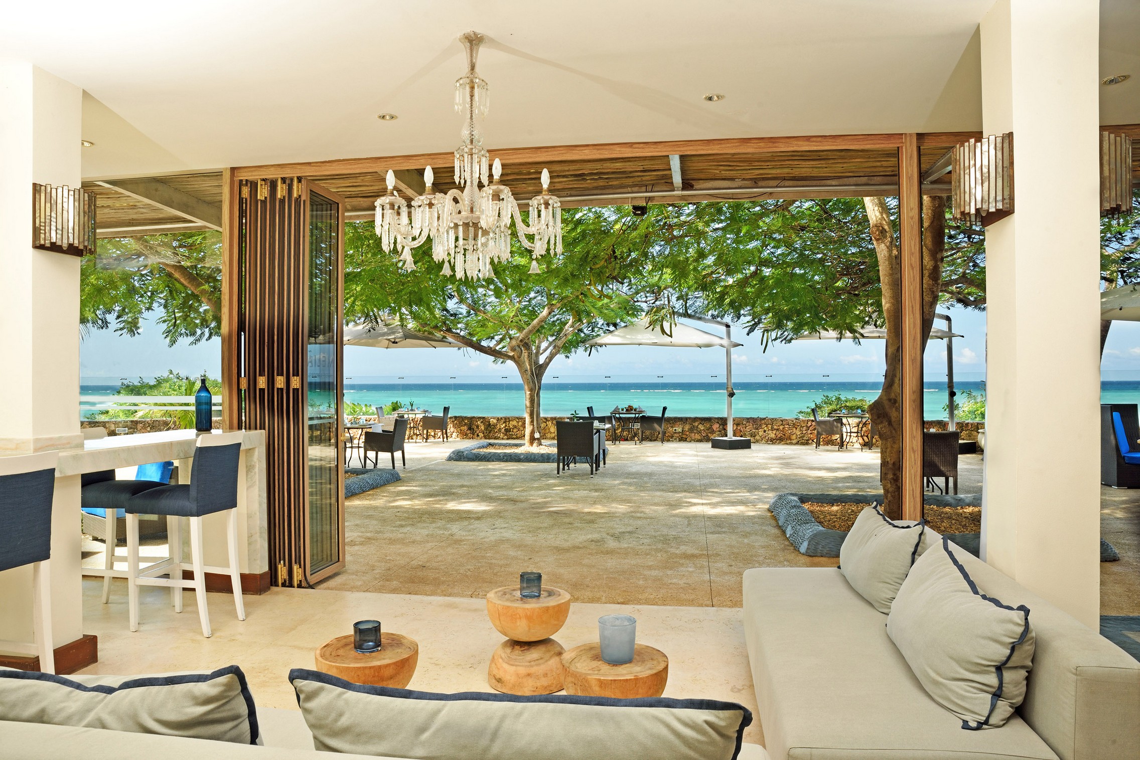 Open air lounge at Melia Zanzibar with a sea view and cozy seating