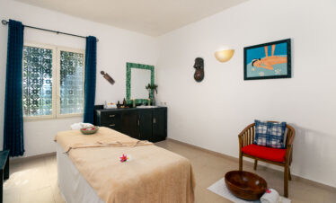 Relaxing spa room with massage bed and decor at Tui Blue Bahari