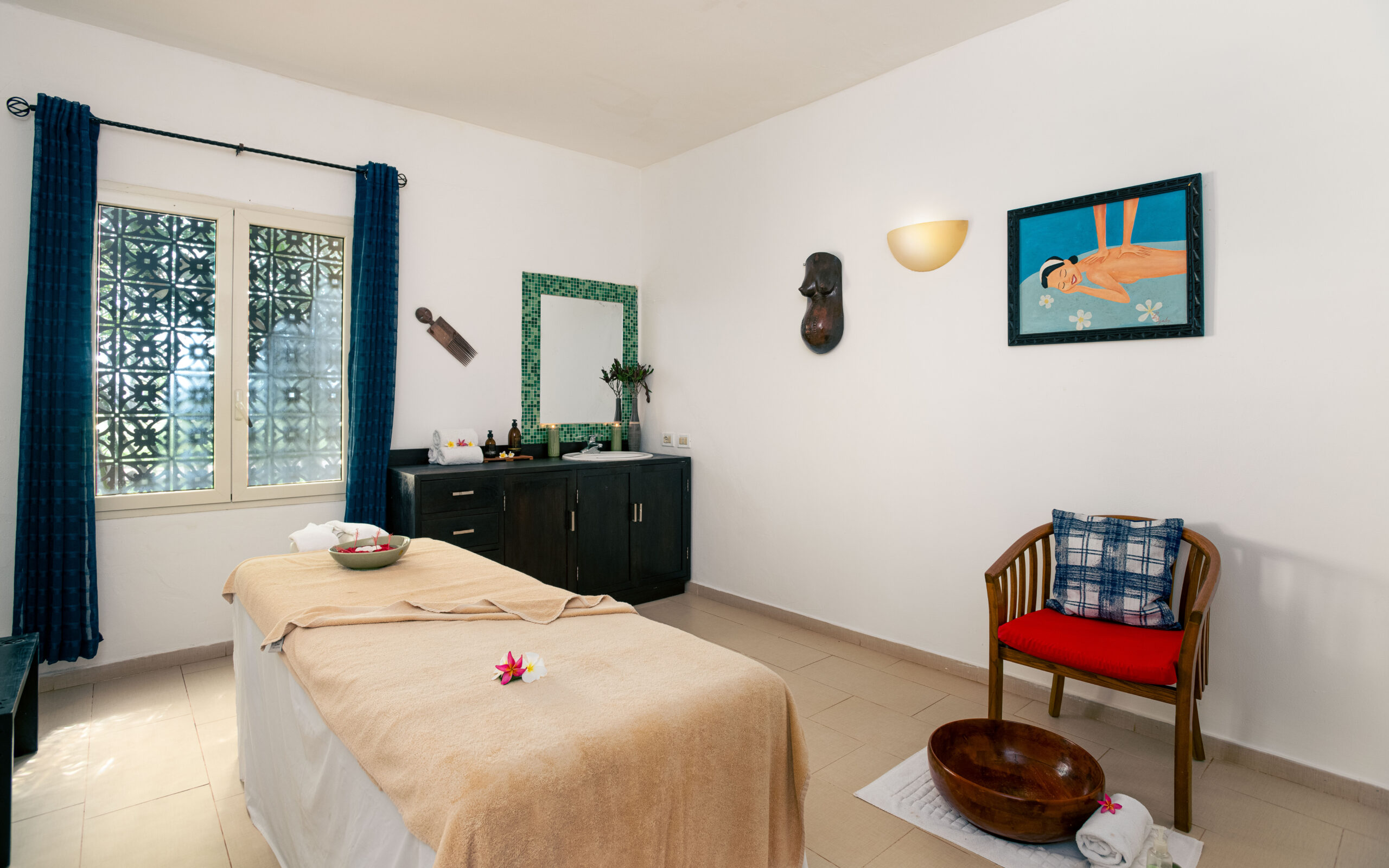 Relaxing spa room with massage bed and decor at Tui Blue Bahari