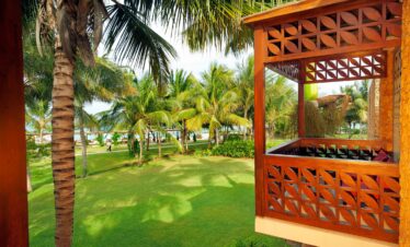 Scenic balcony at Melia Zanzibar overlooking lush tropical gardens