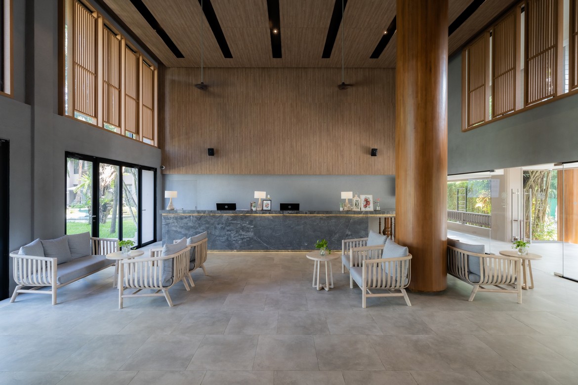 Spacious lobby with modern seating and a welcoming atmosphere at La Flora Khao Lak