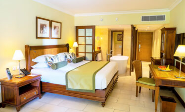 Spacious suite at Maritim Resort with elegant wooden decor