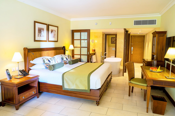Spacious suite at Maritim Resort with elegant wooden decor