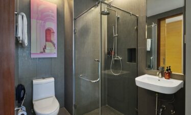 Stylish bathroom at The Kee Resort with glass shower