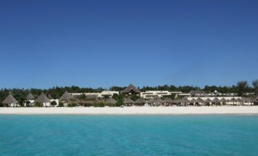 The stunning beachfront view of Gold Zanzibar with azure waters and white sands