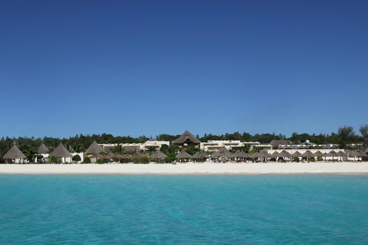 The stunning beachfront view of Gold Zanzibar with azure waters and white sands