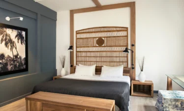 Cozy guest room with wood accents Ravenala Attitude