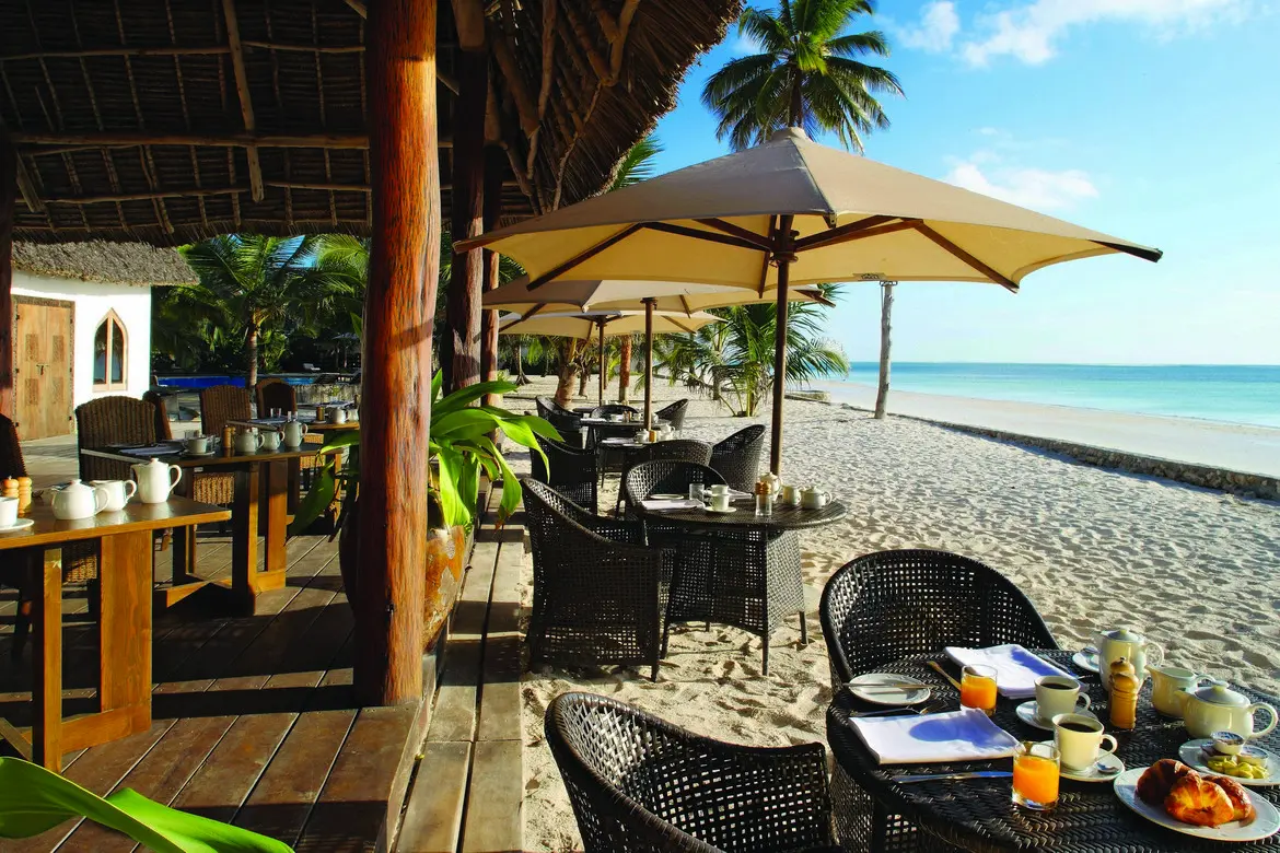 Oceanfront deck dining at Sultan Sands Zanzibar