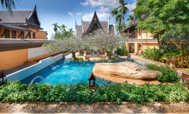 Amari Vogue Krabi swimming pool surrounded by tropical gardens