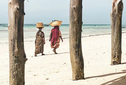 Couple walking on the beach at Matemwe Attitude Zanzibar