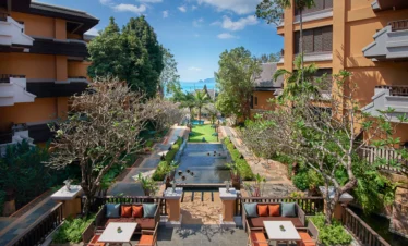 Garden dining area with lush greenery at Amari Vogue Krabi