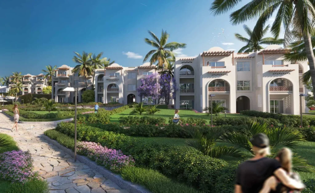 Garden pathway at Diamonds Bijoux Zanzibar with lush greenery and buildings