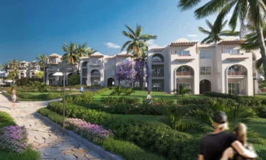 Garden pathway at Diamonds Bijoux Zanzibar with lush greenery and buildings