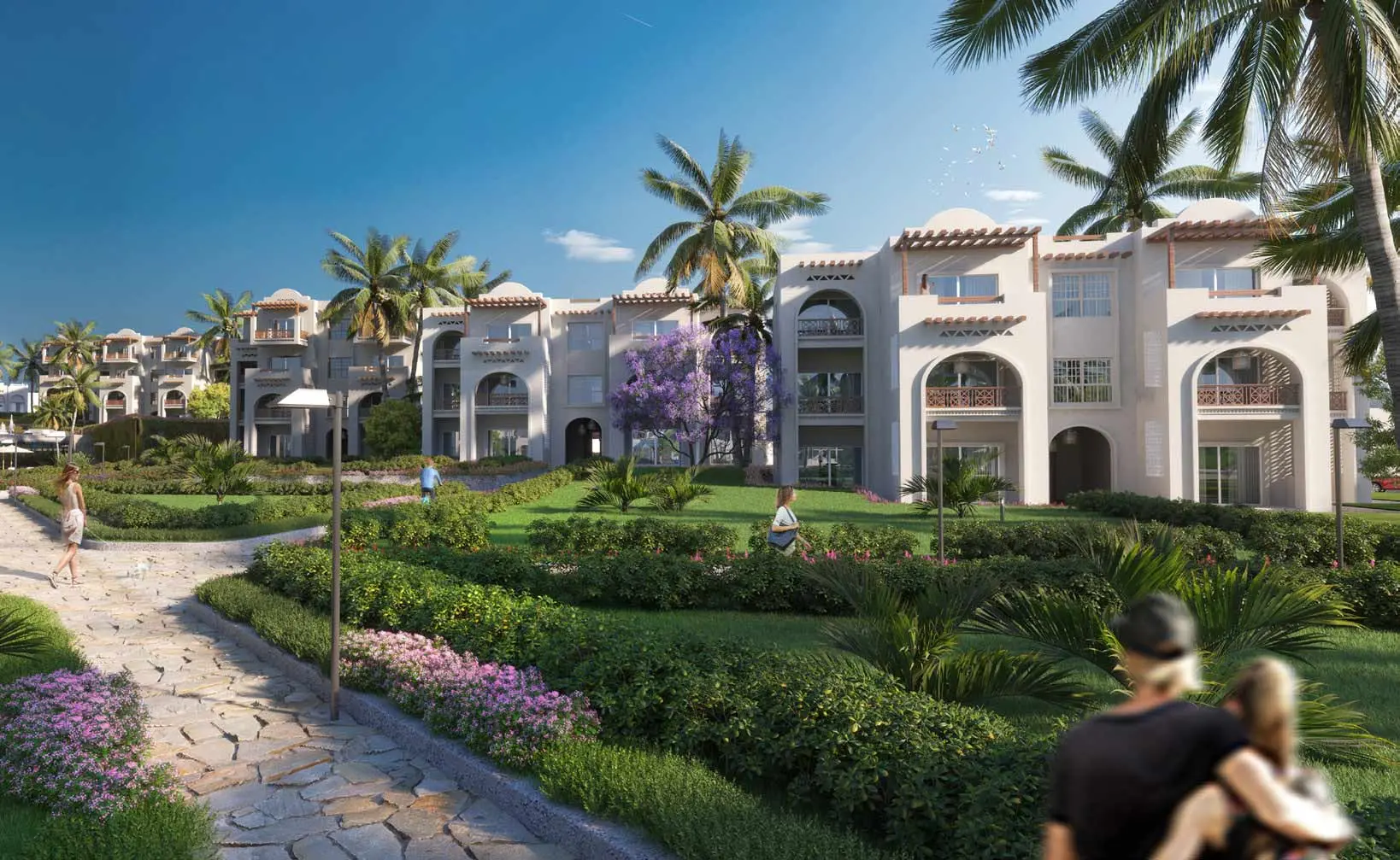 Garden pathway at Diamonds Bijoux Zanzibar with lush greenery and buildings