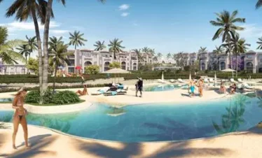 Resort pool at Diamonds Bijoux Zanzibar with sunbathers and palm trees