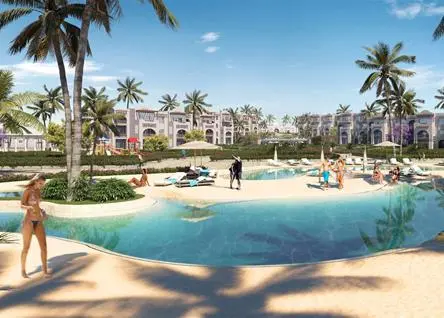 Resort pool at Diamonds Bijoux Zanzibar with sunbathers and palm trees