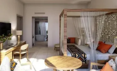Stylish guest room interior at Diamonds Bijoux Zanzibar with canopy bed